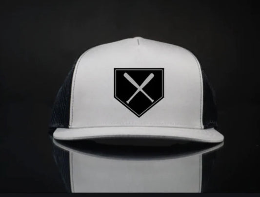 Home plate snap back